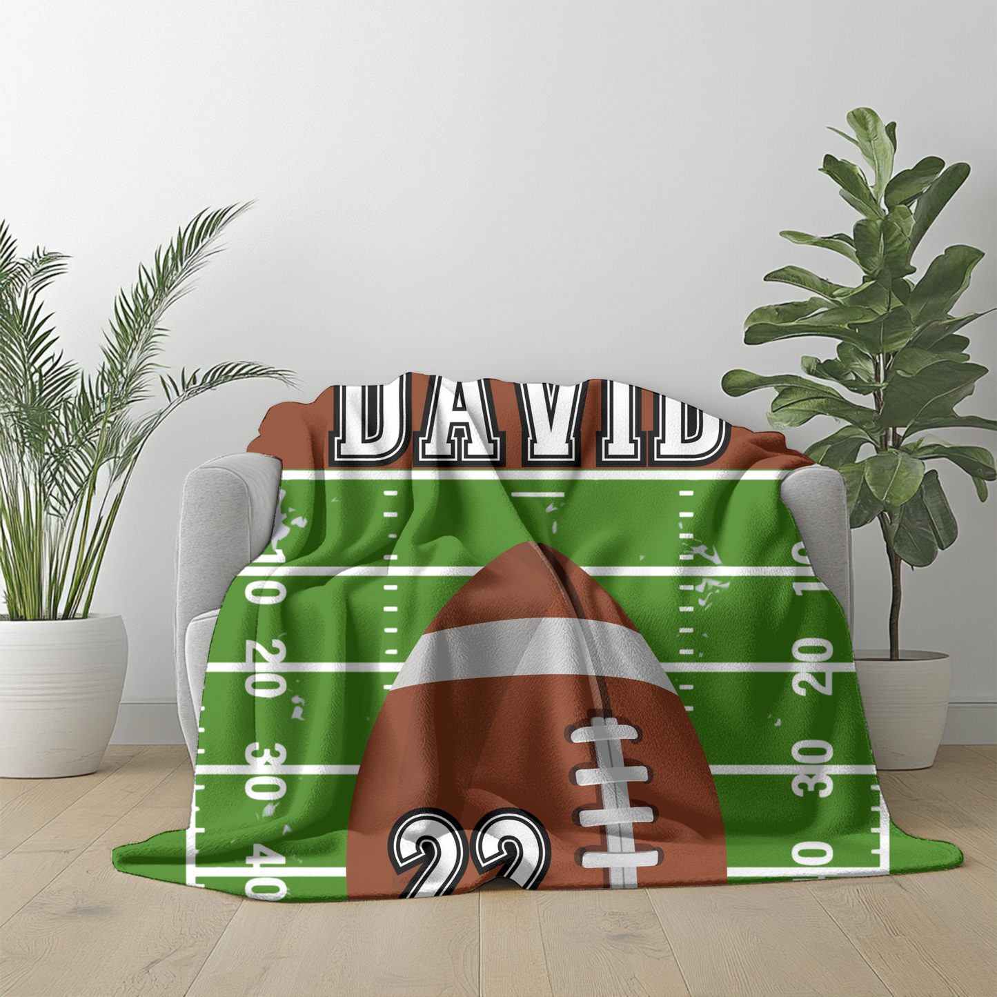 Fleece blanket with a football design customizable with player name and jersey number 